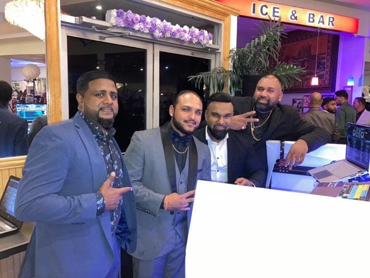 The Waistline Entertainment crew together at the booth, ready for the night