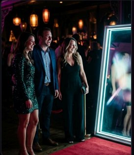 Guests posing at the full-length mirror photo booth