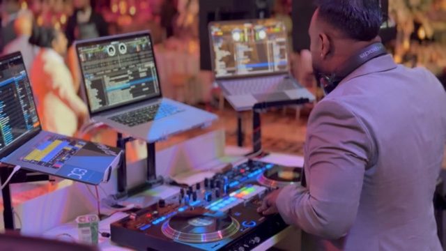 Close-up of the decks and laptops mid-mix