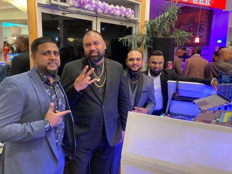 The crew posted up together at the booth